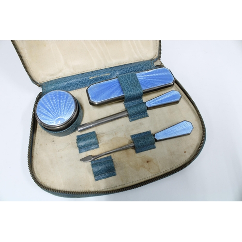 78A - Asprey of London silver and blue enamel manicure set in original blue leather case, comprising circu... 