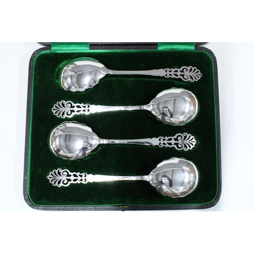 92 - Cased set of four silver gilt serving spoons, with pierced anthemion terminals and shaped bowls, She... 