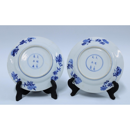 106 - A pair of Chinese blue and white saucer dishes, each with a six character mark (2) 16cm.