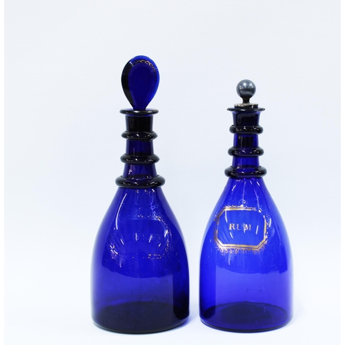 116 - Two Bristol blue glass decanter one with a glass stopper the other with a pewter stopper (2) 29cm.