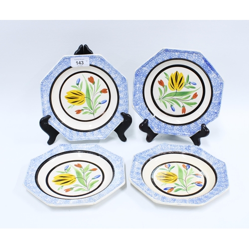 143 - Set of four octagonal creamware plates, with underglaze coloured tulips within spattered blue border... 