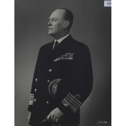 192 - King Olav, black and white photogrphic print, in a glazed frame with coronet, size overall 45 x 66cm