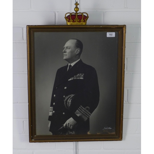 192 - King Olav, black and white photogrphic print, in a glazed frame with coronet, size overall 45 x 66cm