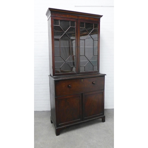 201 - Georgian mahogany secretaire cabinet, the top with glazed doors and a shelved interior over a secret... 