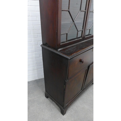 201 - Georgian mahogany secretaire cabinet, the top with glazed doors and a shelved interior over a secret... 