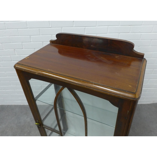 204 - Early 20th century mahogany ledgeback display cabinet with glazed door and shelved interior, on shor... 