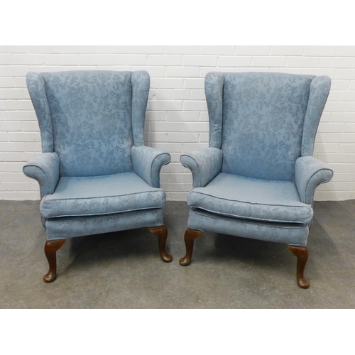 206 - Pair of wingback armchairs with pale blue damask style upholstery, on cabriole legs (2).