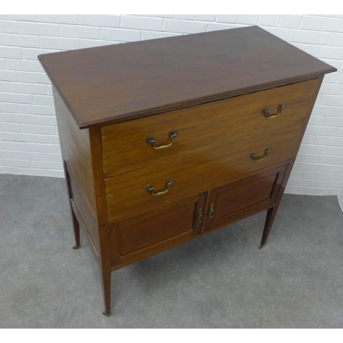 210 - Edwardian mahogany chest, the rectangular top above two long drawers and pair of cupboard doors on s... 