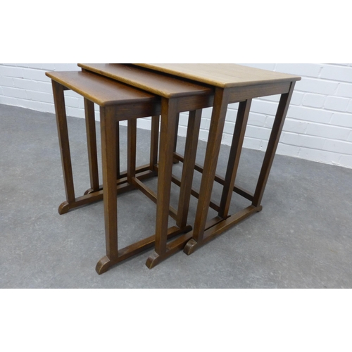 211 - Nest of three teak tables. 54 x 56 x 38cm.