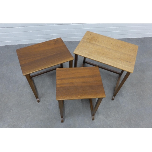 211 - Nest of three teak tables. 54 x 56 x 38cm.