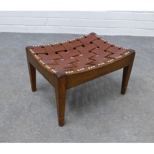 215 - An Arts & Crafts oak and leather stool by Arthur W. Simpson, the concave top with leather lattice, o... 