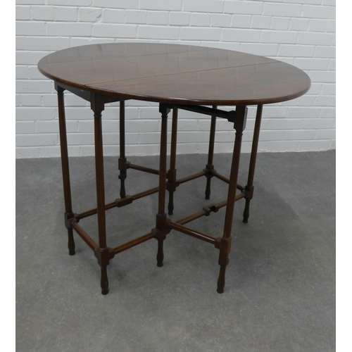 220 - Edwardian mahogany spider gateleg table, with oval drop leaf sides. 72 x 95 x 87cm.