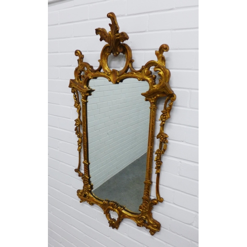 222 - Rococo style gilt framed wall mirror. 109 x 59cm.