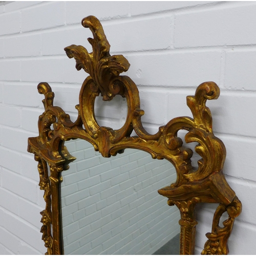 222 - Rococo style gilt framed wall mirror. 109 x 59cm.