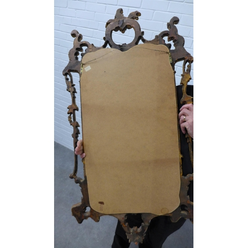 222 - Rococo style gilt framed wall mirror. 109 x 59cm.