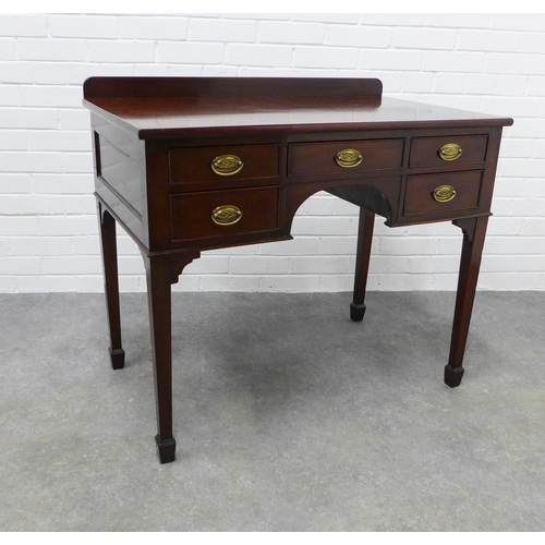 224 - Mahogany ledge back desk with five drawers, brass handles and square tapering legs with spade feet .... 