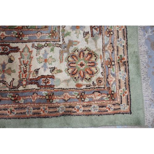 239 - Large pale green carpet with central medallion and flowerhead border, 414 x 324cm (a/f)