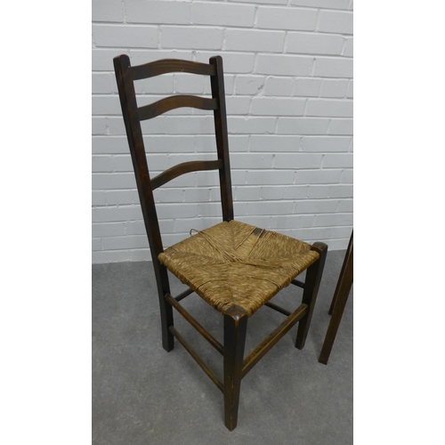 251 - An Arts & Crafts  chair with woven rush seat and an oak side table. 67 x 35cm. (2)