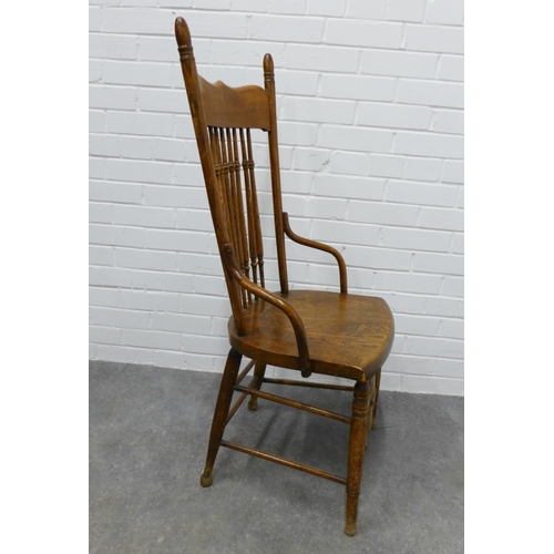 256 - An Arts & Crafts oak spindle back chair in the manner of William Birch, . 109 x 50 x 42cm.