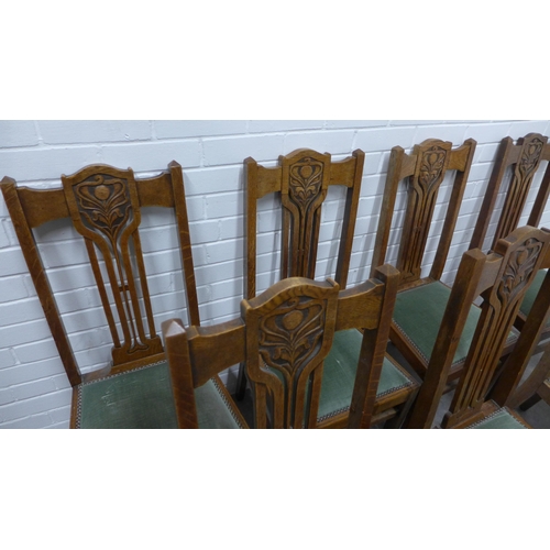 260 - Set of eight Art Nouveau oak chairs with upholstered seats,  103 x 44 x 40cm. (8)