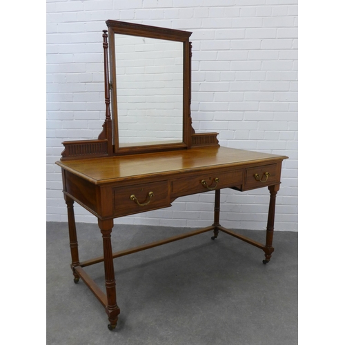 282 - Mahogany dressing table with mirror and three short drawers, on fluted legs with three quarter stret... 