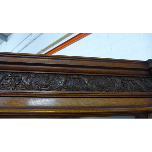 292 - Victorian oak three-part wall cabinet with central desk area with green skiver and two frieze drawer... 