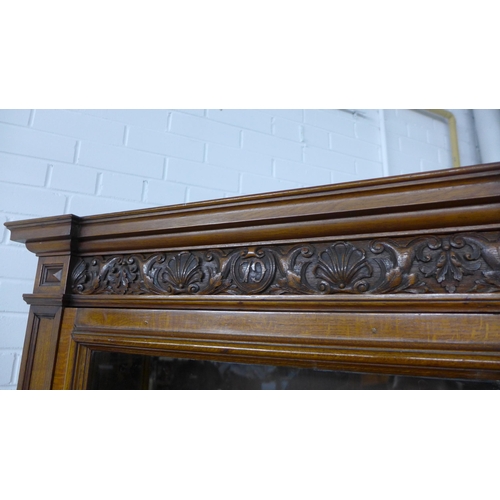 292 - Victorian oak three-part wall cabinet with central desk area with green skiver and two frieze drawer... 