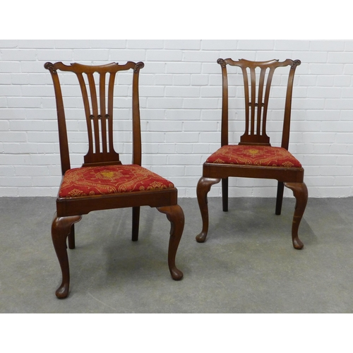 310 - Pair of mahogany side chairs with carved toprails, vertical splat backs and upholstered seats, on ca... 