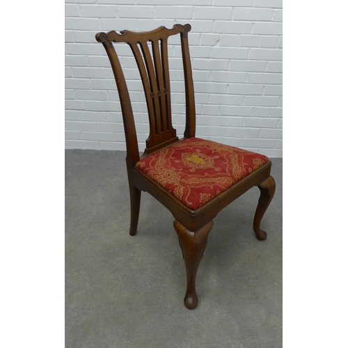 310 - Pair of mahogany side chairs with carved toprails, vertical splat backs and upholstered seats, on ca... 