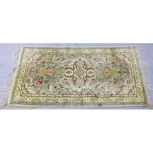 314 - Eastern wool rug, pale green field with allover foliate pattern, 186 x 94cm