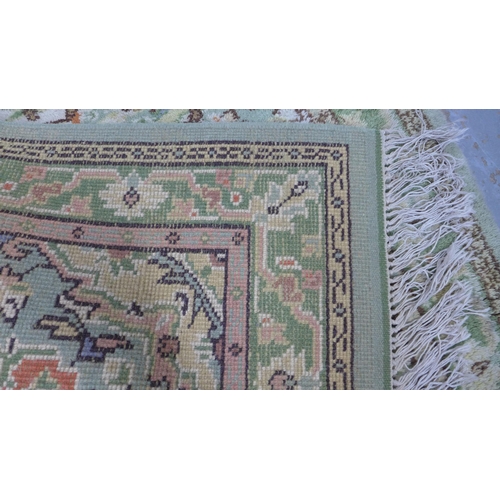 314 - Eastern wool rug, pale green field with allover foliate pattern, 186 x 94cm