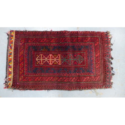 317 - Belouch mat / small rug,with a flatweave backing with sign of old moth damage, 105 x 59cm