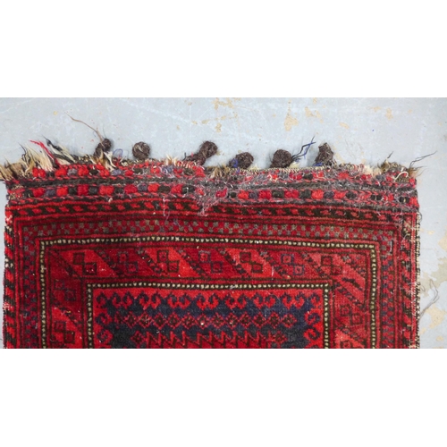 317 - Belouch mat / small rug,with a flatweave backing with sign of old moth damage, 105 x 59cm