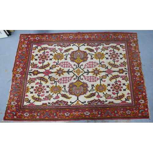 318 - Persian rug, ivory field with flowers and foliage within a red border, 265 x 185cm