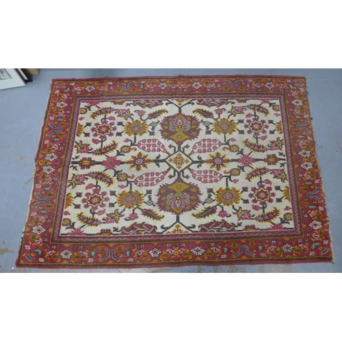 318 - Persian rug, ivory field with flowers and foliage within a red border, 265 x 185cm