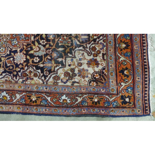 319 - Persian rug with all-over foliate pattern, ivory spandrels and blue borders,  166 x 110cm