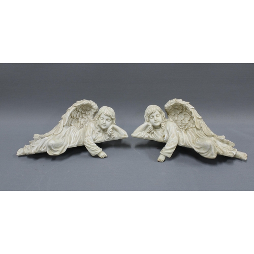 334 - Pair of resin angels, each in recumbent pose with an overhanging arm, 28cm (2)