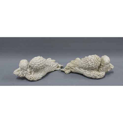 334 - Pair of resin angels, each in recumbent pose with an overhanging arm, 28cm (2)