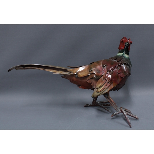 335 - A large painted metal model of a Pheasant, 58cm long