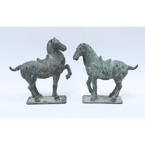 341 - A pair of Verdigris patinated bronze Tang style horses, 20cm high (2)