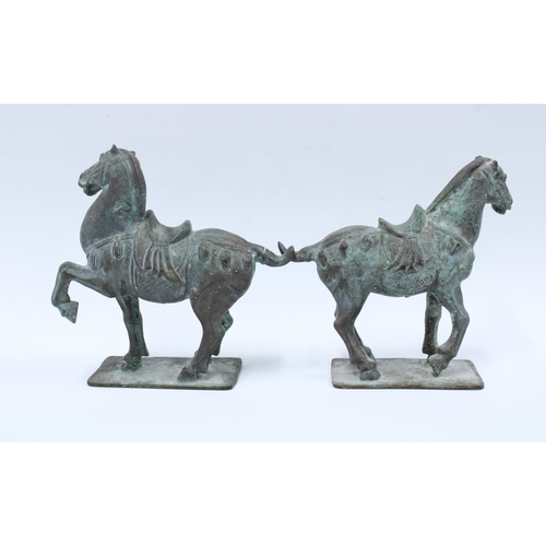 341 - A pair of Verdigris patinated bronze Tang style horses, 20cm high (2)