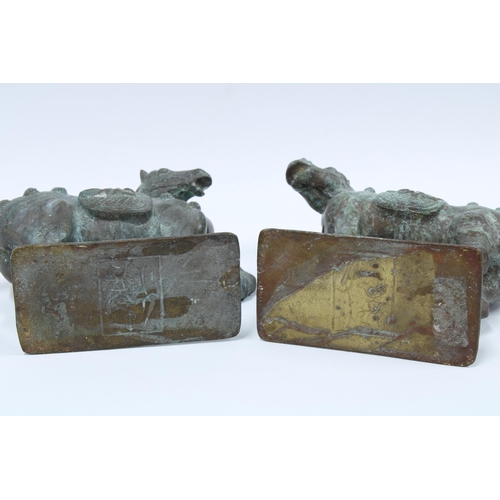 341 - A pair of Verdigris patinated bronze Tang style horses, 20cm high (2)