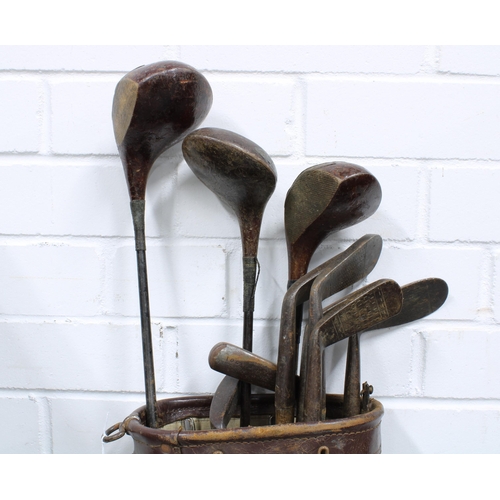 354 - Vintage golf clubs and a golf bag (a lot)