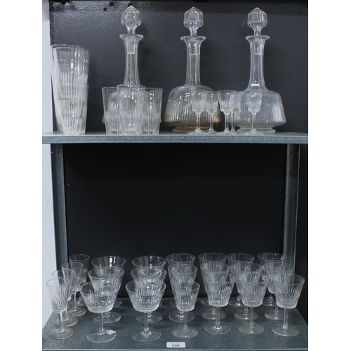 358 - Part suite of vintage Stuart Crystal to include three decanters with stoppers, and various stemware ... 