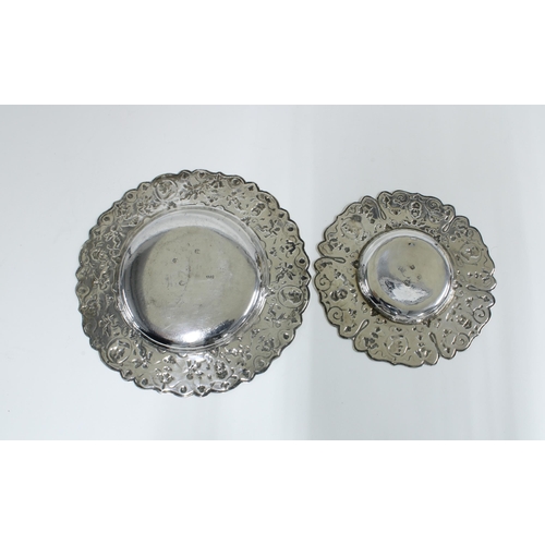 36 - Two Continental silver plates, each with repoussé decoration and one inscribed To Laura 1908', 14.5c... 