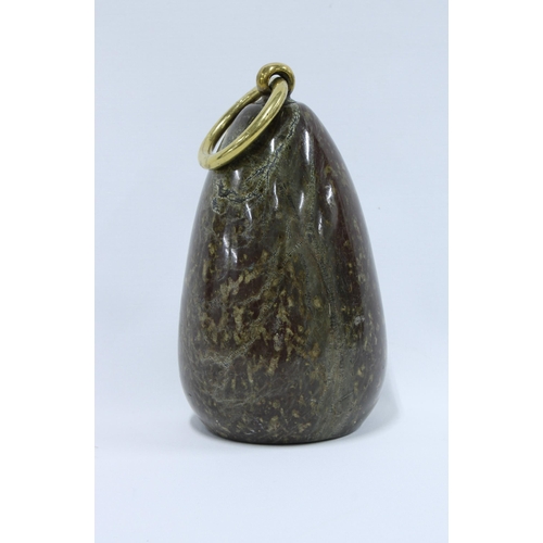 369 - Polished hardstone doorstop with a brass loop, 21cm excluding brass loop