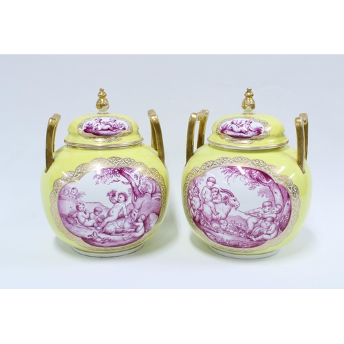 370 - Pair of Helena Wolfsohn yellow ground vase and covers with gilt handles and puce pattern of cherubs,... 