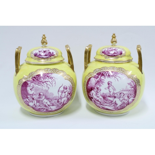 370 - Pair of Helena Wolfsohn yellow ground vase and covers with gilt handles and puce pattern of cherubs,... 