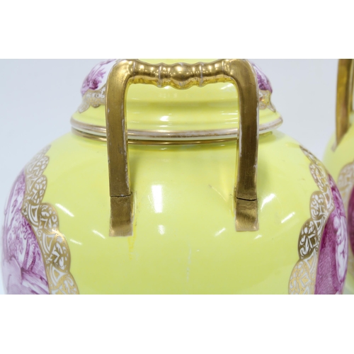 370 - Pair of Helena Wolfsohn yellow ground vase and covers with gilt handles and puce pattern of cherubs,... 