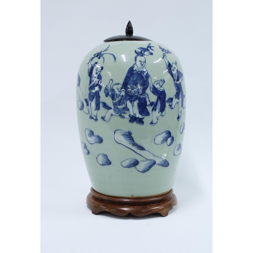 372 - Chinese celadon ground jar and cover with underglaze pattern of blue and white figures , with wooden... 